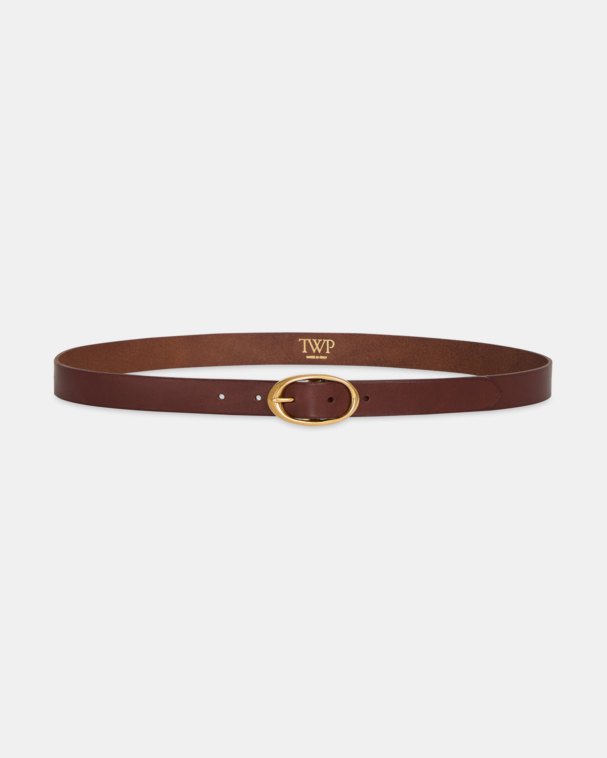 Dark Luggage Vachetta Leather Narrow Belt, Antique Gold Oval Buckle - Flat Lay | TWP Clothing